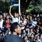 Supporters of Jawar Mohammed, a member of the Oromo ethnic group who has been a critic of Prime Minister Abiy Ahmed, gathered outside his home in Addis Ababa on Thursday after he accused security forces of trying to orchestrate an attack on him