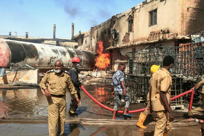 Sudanese firefighters tackle the deadly blaze in a north Khartoum ceramics factory