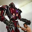 Made from recycled motorbike parts, 'Robot One' has an environmental message, says engineer Do Danh Phong (L)