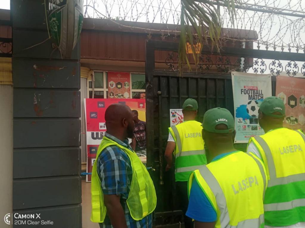 Officials of the Lagos State Environment Protection Agency (LASEPA) sealing off some religious centres and other facilities allegedly contravening the environmental law of the state. [Twitter/@LasepaInfo]