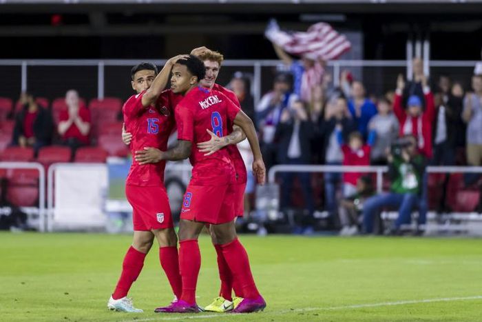 Weston Mckennie of the United States celebrates with Cristian Roldan and Josh Sargent in the first half of a 7-0 victory over Cuba in the 2019 CONCACAF Nations League in Washington