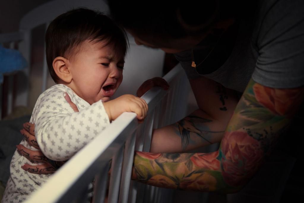 Mummy lulling baby to sleep. Debica, Poland