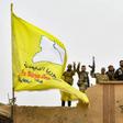 Syrian Kurdish fighters raise their flag in March after overrunning the last vestige of the Islamic Strate group's "caliphate" in a US-backed offensive they had hoped would earn them Western support for their dreams of self-rule