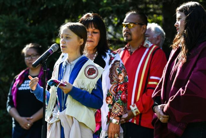 Swedish climate activist Greta Thunberg, with indiginous leaders, ahead of a 'climate strike' march in Montreal, Canada