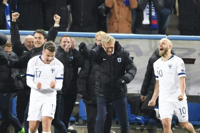 Finland celebrate qualifying for their first appearance at the finals of a major tournament