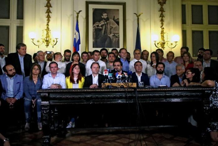 Chilean lawmakers at a press conference after reaching agreement on holding a referendum to change the constitution, a key demand of protesters during a month of violent unrest