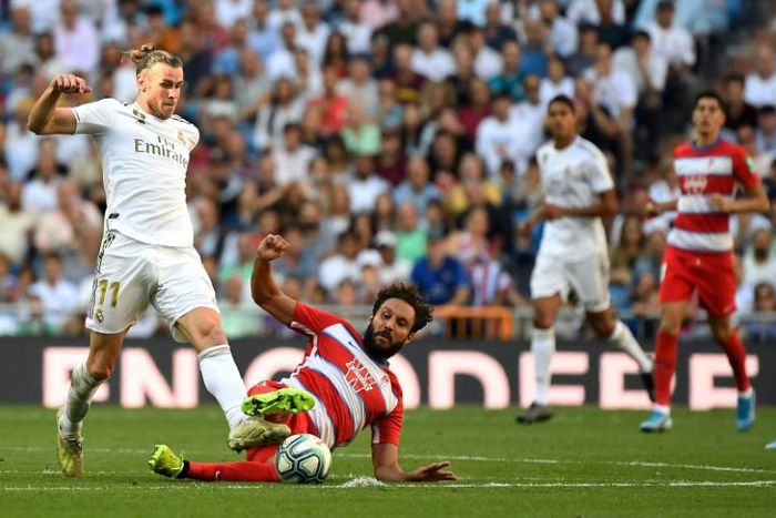 Real Madrid's Welsh forward Gareth Bale plays against Granada in La Liga on October 5