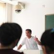 Ilham Tohti, a Uighur scholar imprisoned in China whom the European Parliament has put on its shortlist for the Sakharov Prize, lectures in a classroom in Beijing in 2010