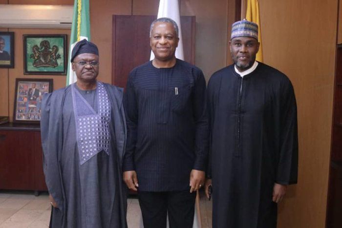 Foreign Affairs Minister Geoffrey Onyeama flanked by the Minister of State Amb. Zubairu Dada (left) and the Permanent Secretary in the ministry, Amb. Mustapha Suleiman ( right) pose for a shot when the minister assumed office on Wednesday in Abuja.  [N...