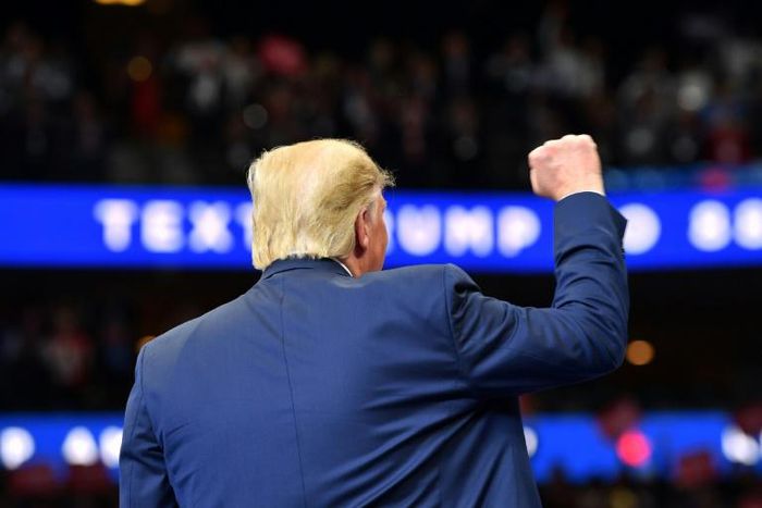 US President Donald Trump is seen speaking at a rally in Dallas, Texas, on October 17, 2019, during one of his most difficult weeks in office