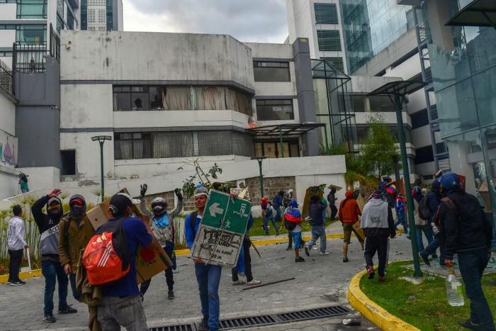 Demonstrators break into the General Comptrollers Office building during the 10th day of protests over a fuel price hike ordered by the government to secure an IMF loan
