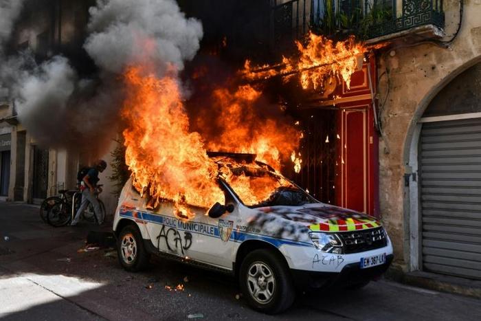 A French police car was set on fire on the sidelines of an anti-government demonstration called by the "Yellow Vests" movement in Montpellier, southern France