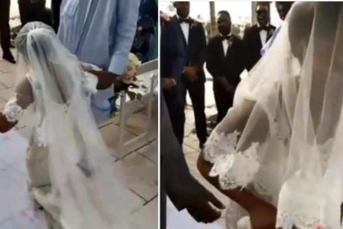 Angry bride walks away from her wedding after kneeling down to apologise to her father