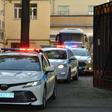 A police convoy escorts two buses with tinted windows from the high-security prison of Lefortovo in Moscow as a long-awaited exchange of prisoners between Moscow and Kiev gets underway