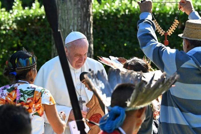 The Pope Francis receives gifts from representatives of indigenous Amazonian communities in the Vatican gardens on October 4. He apologised on Friday after indigenous statuettes were stolen from a church and thrown in the Tiber river