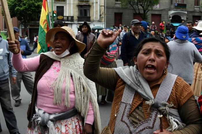 Supporters of Bolivia's ex-president Evo Morales protest in La Paz after he left for exile in Mexico