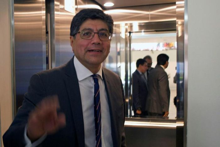 Ecuador's Foreign Minister Jose Valencia gestures after a press conference in which he announced that four opposition deputies had been granted political asylum by Mexico