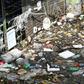 Bottles, styrofoam and other plastic waste thrown into the sea float by a pier in Singapore