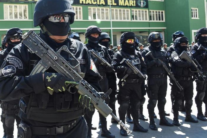 Members of Bolivia's GAT anti-terrorist unit stand guard as they are presented in La Paz, on December 3