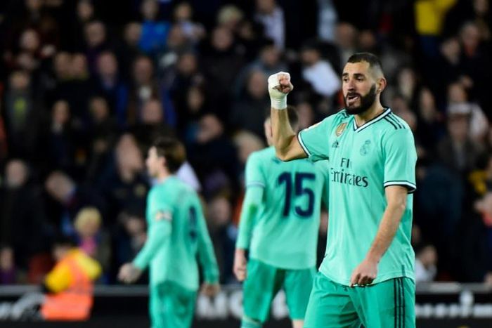 Late strike: Real Madrid's Karim Benzema celebrates after scoring