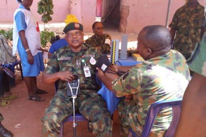 Brig.-Gen. Greg Omorogbe being attended to by an Army medical corps personnel during the 4 Brigade free medical outreach in Uhiele community near Ekpoma, in Edo. (NAN)