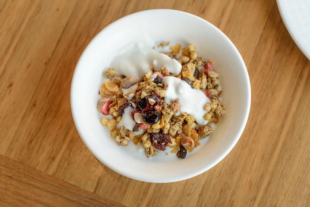 High Angle View Of Breakfast In Bowl On Wooden Table