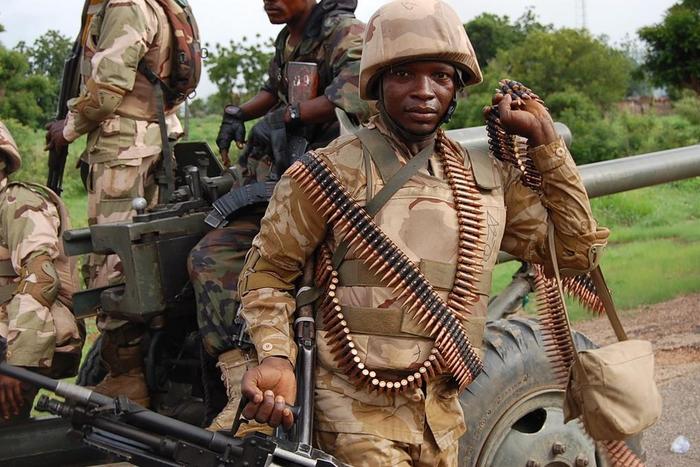 Troops of the Multi-National Joint Task Force (MNJTF) in a dawn raid operation.