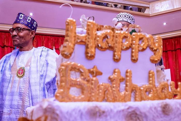 President Muhammad Buhari as he cut his 77th birthday Cake at Residence Presidential villa (LIB)