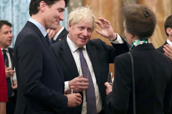 Britain's Princess Anne talks to Britain's Prime Minister Boris Johnson, Canada's Prime Minister Justin Trudeau and other NATO leaders at Buckingham Palace