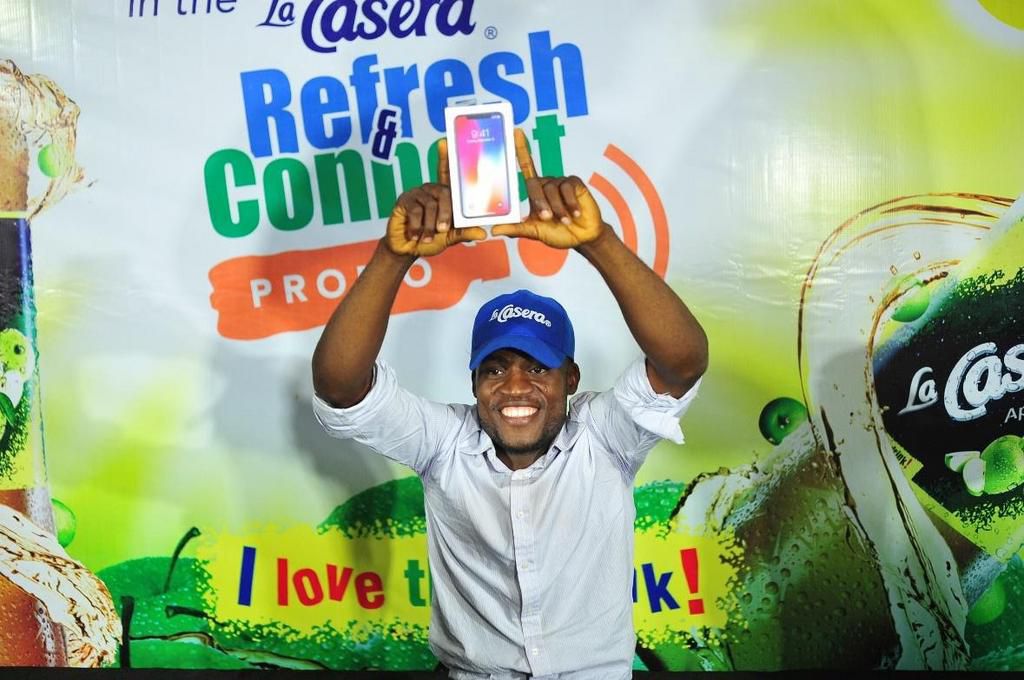 The star prize of the day; the latest IPhone winner, Oladapo Tunde Joshua