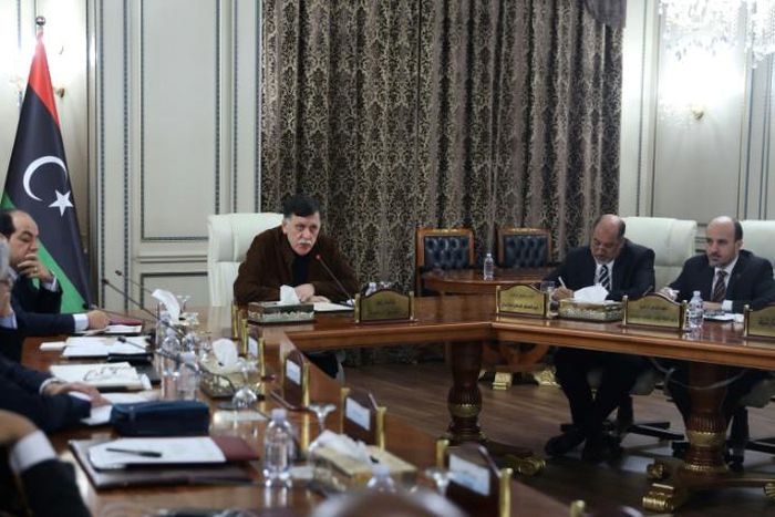 Libya's UN-recognised Prime Minister Fayez al-Sarraj (C) presided over a cabinet meeting where the implementation of a military deal with Turkey was 'unanimously approved'