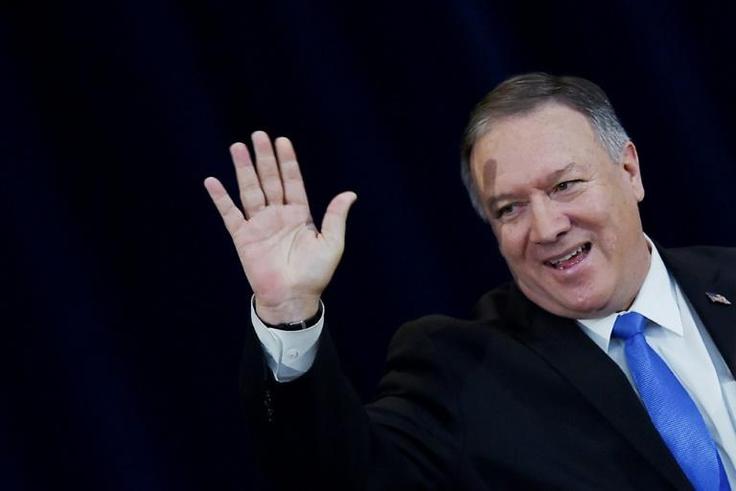 US Secretary of State Mike Pompeo waves after delivering remarks on human rights in Iran at the State Department