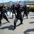 Iraqi Shiite fighters from the Iran-backed Hezbollah brigades take part in a military parade to mark the pro-Palestinian Al-Quds (Jerusalem) Day in Baghdad in May this year