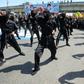 Iraqi Shiite fighters from the Iran-backed Hezbollah brigades take part in a military parade to mark the pro-Palestinian Al-Quds (Jerusalem) Day in Baghdad in May this year