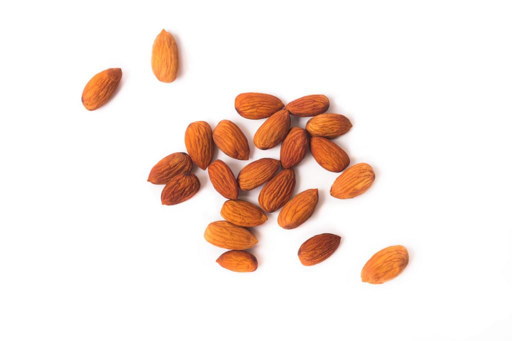 High Angle View Of Almonds On White Background