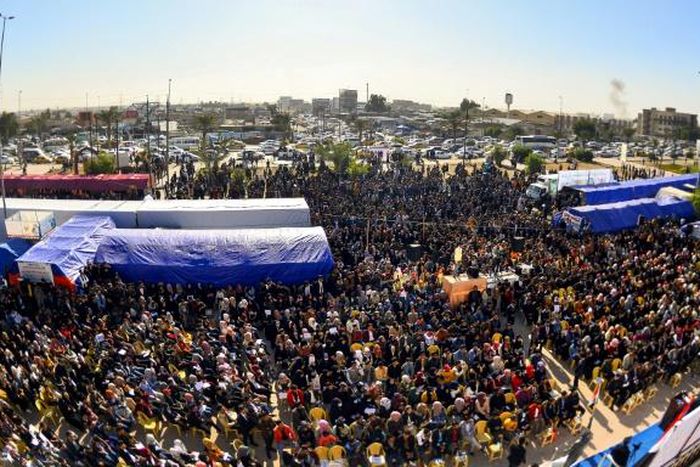 Protesters gather outside Kufa University in the central Iraq on Sunday