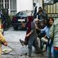 History student Ayesha Renna (red scarf) and three women have become protest symbols after they surrounded a young man to stop him from being beaten by police