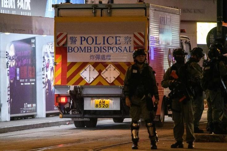 Bomb disposal officers have disabled two homemade nail bombs at a school in Hong Kong