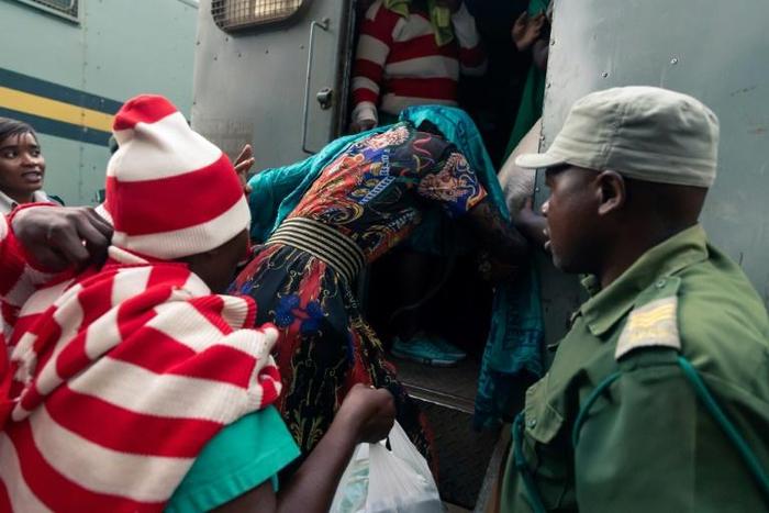 Marry Mubaiwa the wife of Zimbabwe vice-president Constantino Chiwenga covered her head when she was arrested
