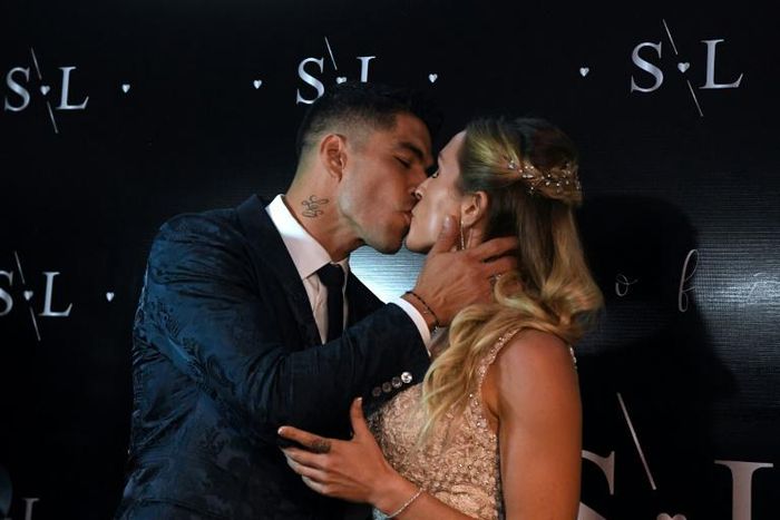 Uruguayan Barcelona forward Luis Suarez and wife Sofia Balbi kiss as before renewing their vows