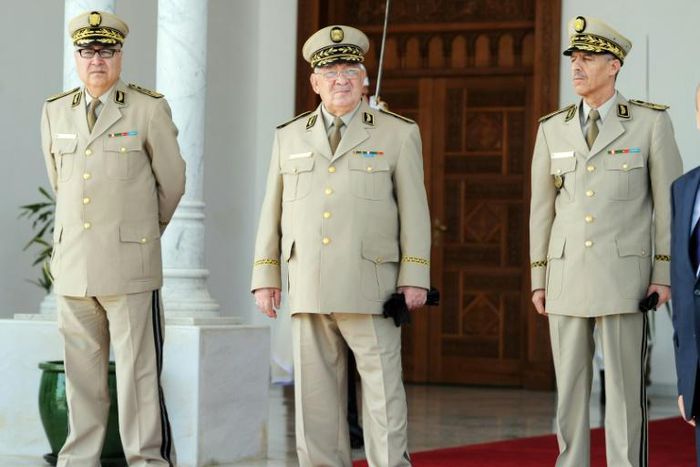 Algeria's military chief Ahmed Gaid Salah (C) became de facto ruler after veteran president Abdelaziz Bouteflika resigned