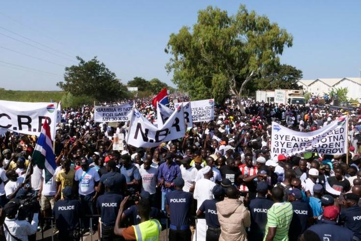 Protesters take part in a demonstration against Gambian President Adama Barrow, calling for him to keep his pledge to quit after three years in office