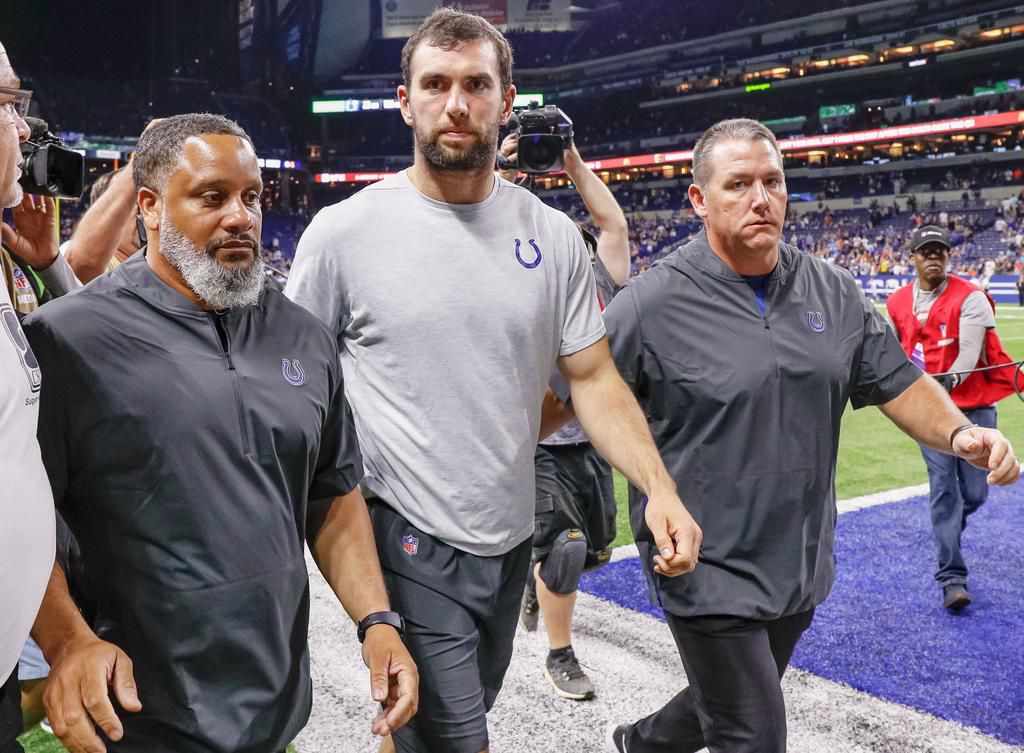 Andrew Luck walks off the field following reports of his retirement after a preseason game at Lucas oil Stadium in August 2019.