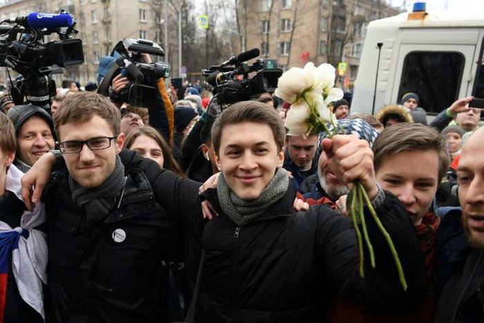 Russian student and blogger Yegor Zhukov is surrounded by supporters outside Moscow's Kuntsevsky district court after getting his suspended sentence