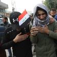 An Iraqi youth cries during the funeral procession of a prominent civil society activist who was shot dead the previous night