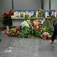 Dozens of people -- airline staff, passengers and locals alike -- gathered in the departure area to pay their respects to the crew, five men and four women