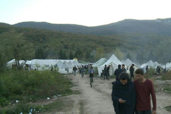 No running water, putrid portable toilets and surrounding woods littered with land mines -- these are the bleak conditions of a camp where hundreds of migrants are bracing for winter in Bosnia