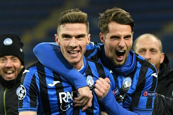 Atalanta defender Robin Gosens (L) celebrates with Hans Hateboer (R) as debutants Atalanta reached the Champions League last 16