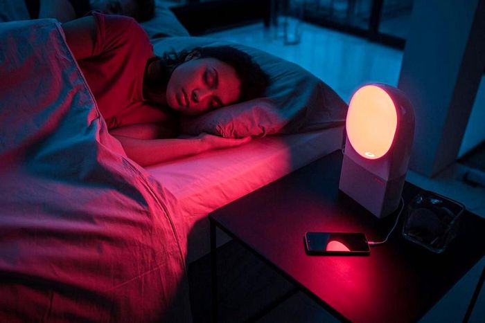 woman sleeping with red lights
