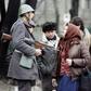 A Romanian soldier with civilians in Bucharest, December 1989